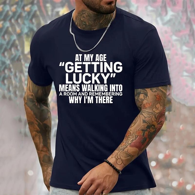 Humorous Men's Graphic T-Shirt featuring 'At My Age Getting Lucky Means Remembering Why I'm There' Quote, Funny Aging Lifestyle Short Sleeve3