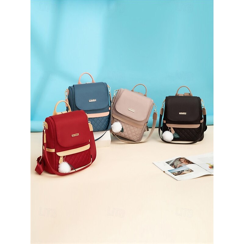 Women's Quilted Red Backpack with Pom Pom Charm – Stylish and Practical Bag with Adjustable Straps and Beige Accents4