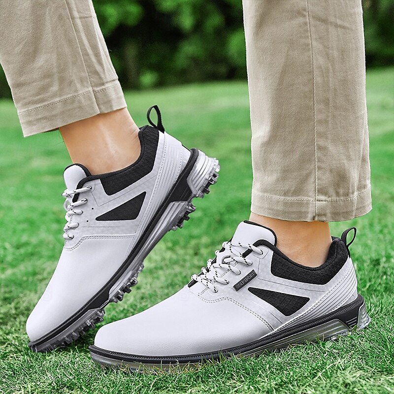 Men's White and Black Golf Shoes with Spiked Sole, Breathable Upper, and Supportive Cushioning for Optimal Comfort and Performance on the Course