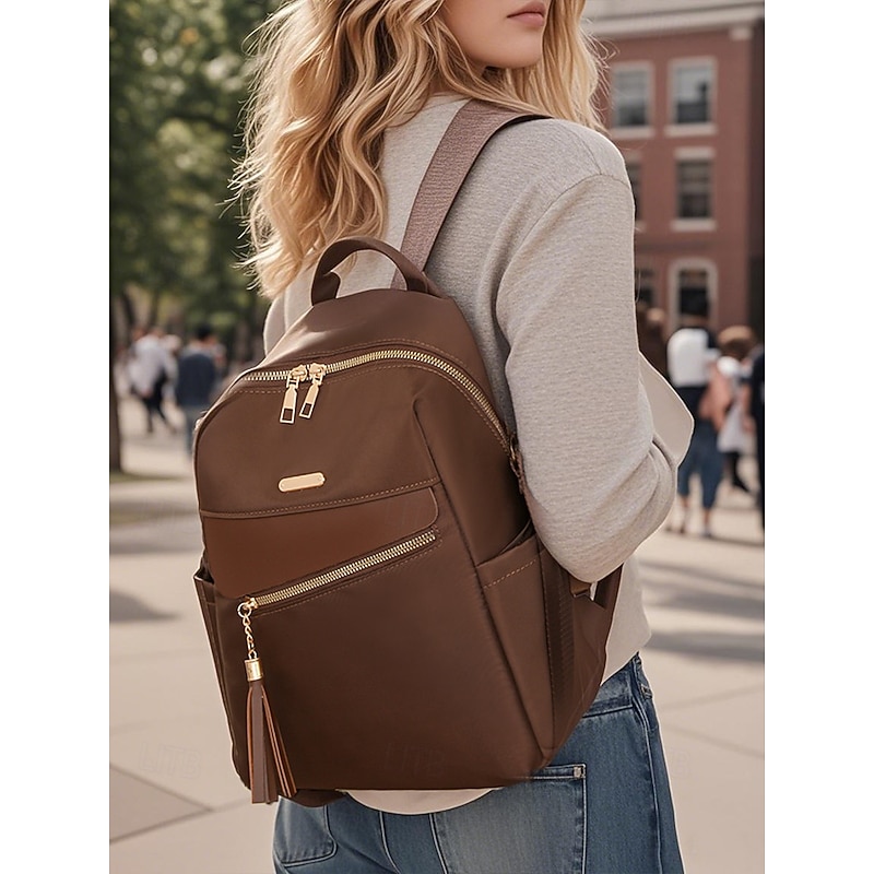 Women's large capacity water-resistant backpack - can be carried on one shoulder, stylish tassel details, zipper closure, suitable for work, school and daily use