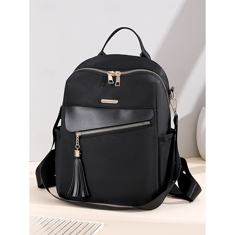 Women's large capacity water-resistant backpack - can be carried on one shoulder, stylish tassel details, zipper closure, suitable for work, school and daily use3