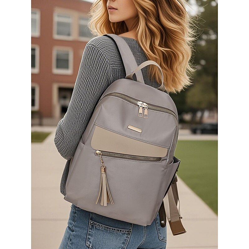 Women's large capacity water-resistant backpack - can be carried on one shoulder, stylish tassel details, zipper closure, suitable for work, school and daily use2
