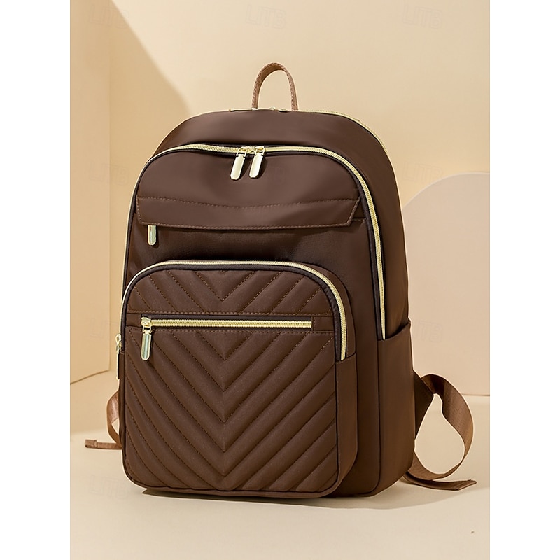 Women's Water-Repellent Nylon Travel Backpack with Quilted Front Pocket, Gold Zippers and Luggage Strap for Business, School and Weekend Trips