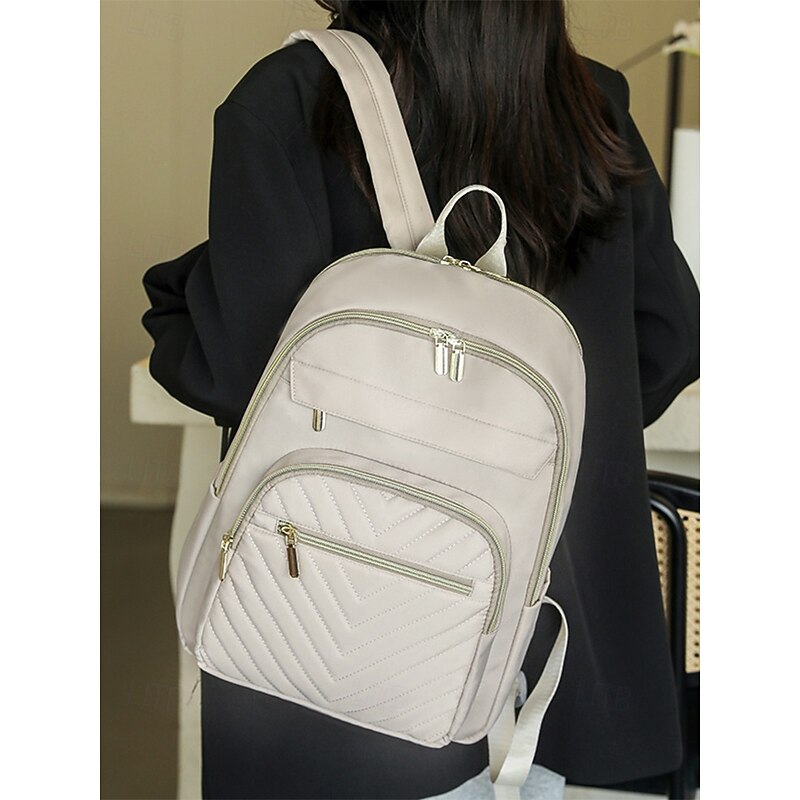 Women's Water-Repellent Nylon Travel Backpack with Quilted Front Pocket, Gold Zippers and Luggage Strap for Business, School and Weekend Trips3