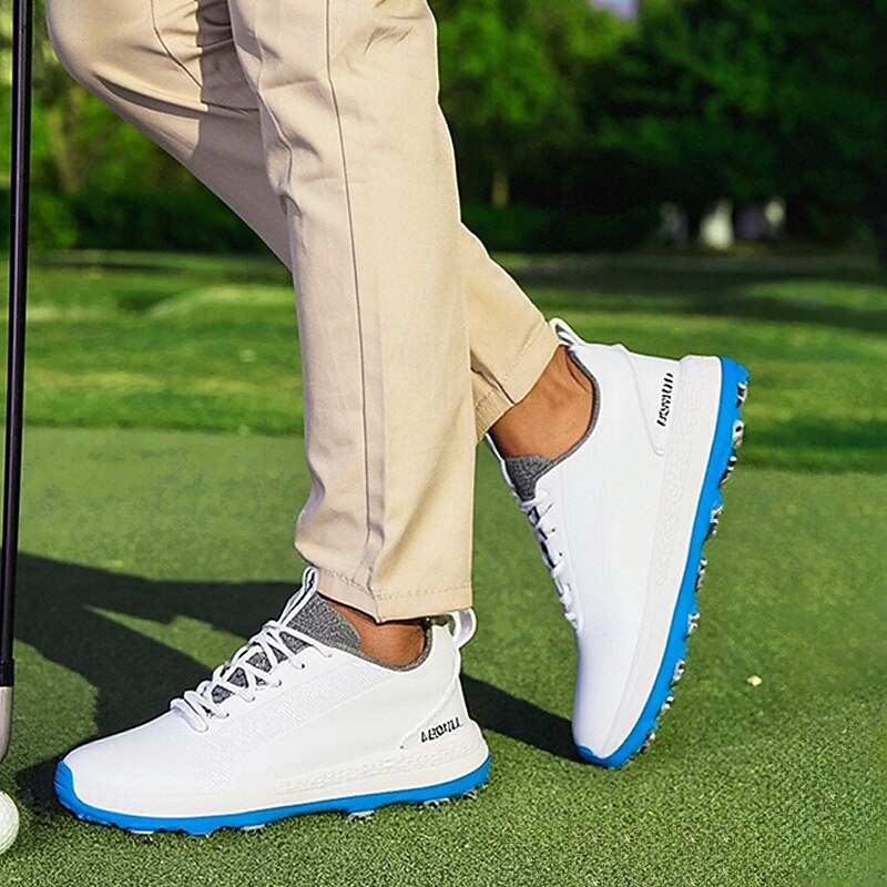 Men's Black and White Golf Shoes with Spiked Sole, Breathable Upper, and Lightweight Design for Comfort and Support on the Golf Course