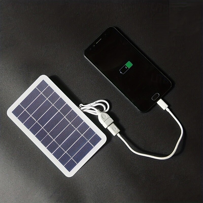 A Single Solar Portable Charging Panel That Is And Designed for Outdoor Use Ideal for Travel And Camping. It Serves As a Mobile Power Source for Charging Phones Powering Flashlights And Running Fan4