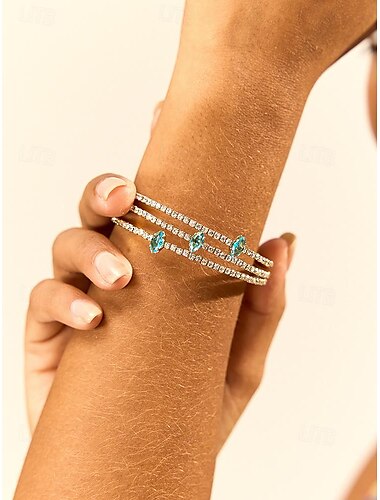  Pulsera de cobre bañada en oro para mujer con circonita azul: joyería elegante para ocasiones formales e informales.