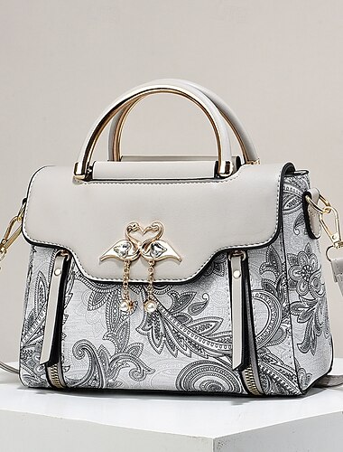  Elegante Damenhandtasche mit Schwanenanhänger – schwarz-weißes Paisley-Design mit goldenen Akzenten und verstellbarem Riemen