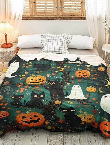  ハロウィーンのカボチャブランケット。心地よくて柔らかいスロー。不気味な季節にぴったり。カボチャデザインのハロウィーンのお祝いの装飾。