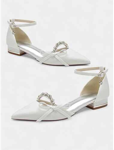  weiße, strassbesetzte Brautschuhe mit spitzer Spitze, Schleifendetails und Fesselriemchen für Abendanlässe und Hochzeiten