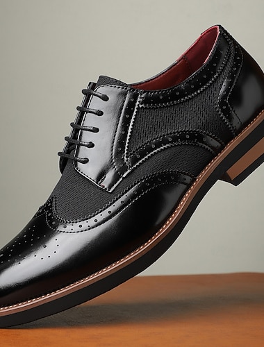  Svarte herresko i brogue-skinn med klassisk vingetuppdesign – elegant formelt fottøy til bryllup og forretningsarrangementer