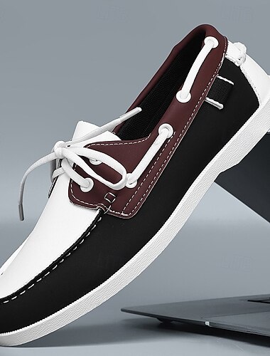  Chaussures bateau bicolores noires et blanches pour hommes avec un design à lacets classique, confortables et élégantes, idéales pour les sorties à la plage, les tenues décontractées et les événements d'été