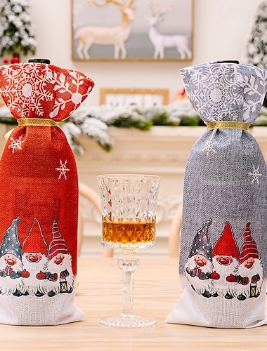  2 kpl jouluisia tonttuviinipullonkorkkeja, Rudolf ja metsänvanhempi -lumihiutalekuvioisia viinipullopusseja, juhlavia viinipullonsuojuksia