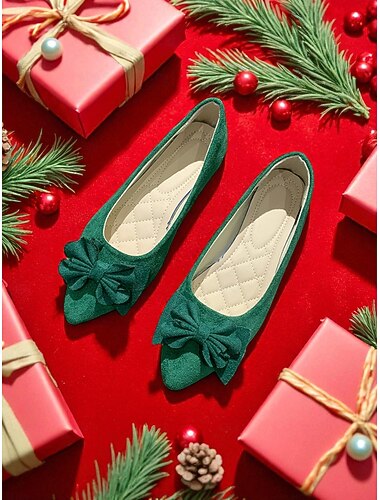  リボンディテールのエレガントなクリスマススタイルの女性用フラットシューズ。ホリデーの装いやお祝いの集まりに最適です。