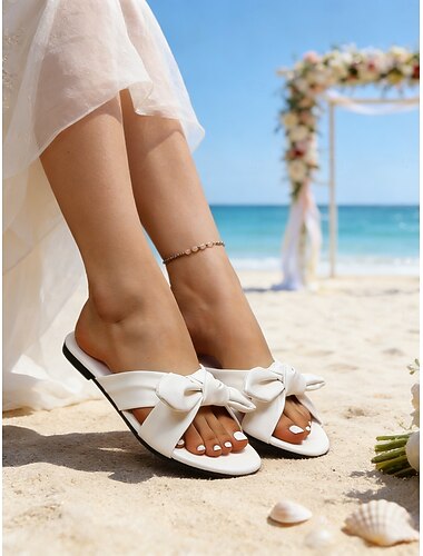  Elegante witte platte sandalen voor dames met strikdetail – comfortabele zomerschoenen voor strandbruiloften en andere gelegenheden.