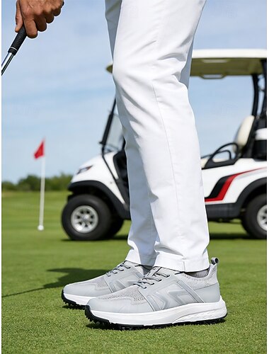  férfi szürke golfcipő, légáteresztő hálós felsőrésszel, párnázott talppal, könnyű, sportszerű stílus golfpályákra és szabadtéri tevékenységekhez.