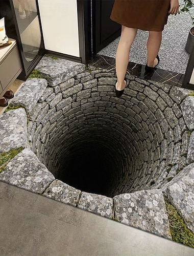  Fußmatte mit 3D-Optik-Täuschung und tiefem Brunnenmotiv aus 2D-Flachdruck auf strapazierfähigem Material – perfekt, um jedem Eingangsbereich rustikalen Charme zu verleihen.