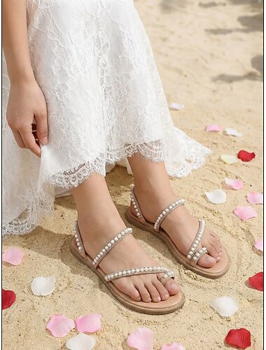  Platte sandalen voor dames met parelversiering - comfortabele en elegante schoenen voor strandbruiloften.