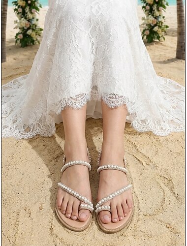  Platte sandalen voor dames met parelversiering - comfortabele en elegante schoenen voor strandbruiloften.
