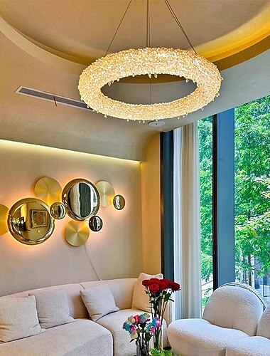  Lustre moderno e luxuoso com design circular em aço inoxidável, cristais e iluminação LED para sala de estar.
