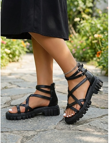  Zwarte gladiatorsandalen met platformzool voor dames, voorzien van bandjes aan de bovenkant, een ritssluiting aan de achterkant en een verstelbare gesp bij de enkel. Ideaal voor op reis, vakantie, een
