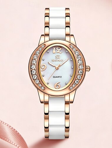  Montre-bracelet élégante pour femme, en or rose, bracelet à maillons en céramique blanche, cadran en nacre avec lunette en cristal, mouvement à quartz. Un bijou parfait à offrir.
