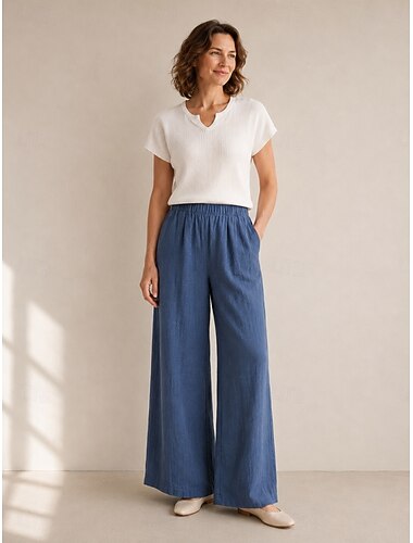  Calça feminina de linho orgânico, pernas largas, cintura elástica e bolsos.